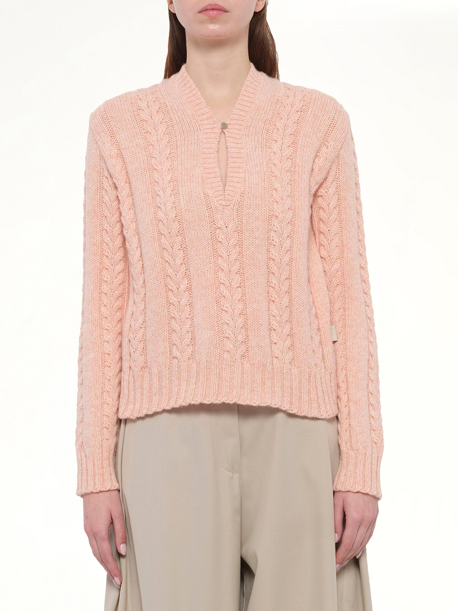 Image of a model wearing Outerwear. Product name - Sweater in Pink colour by brand - LOEWE