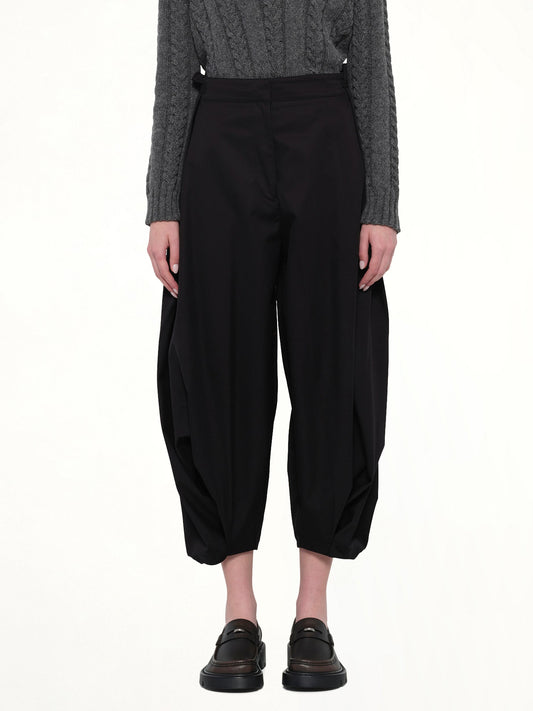 Image of a model wearing Pants. Productname: LOEWE Draped Trouser AF in Black colour by brand - LOEWE