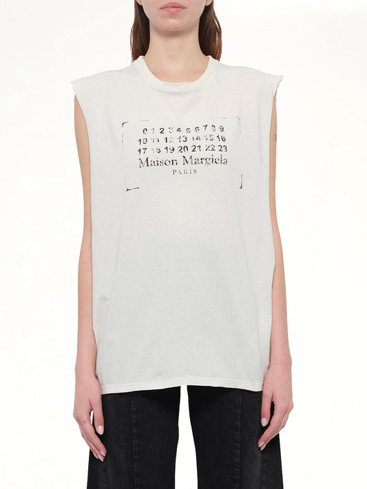 Image of a model wearing Tops. Product name - Logo Tank Top in Butter colour by brand - MAISON MARGIELA