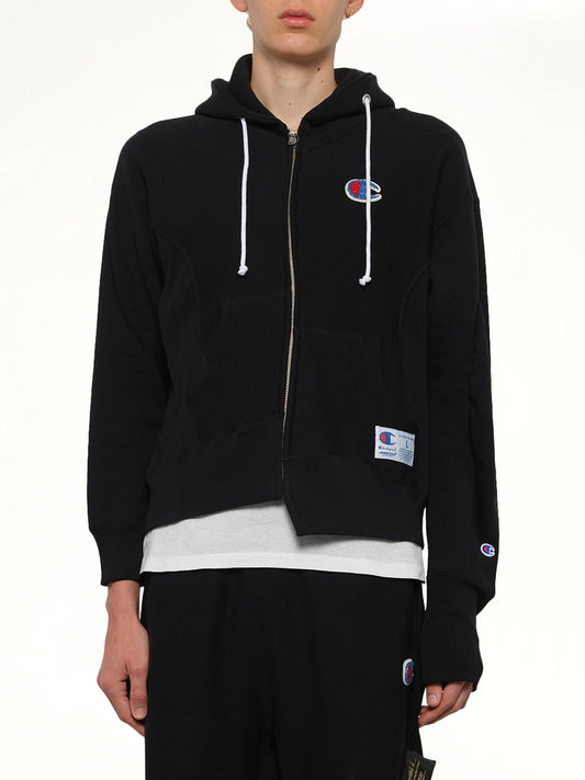 Image of a model wearing Outerwear. Product name - Undercover X Champion Zip Hoodie in Black colour by brand - UNDERCOVER