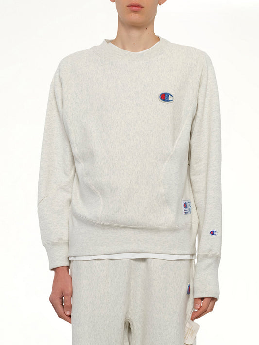 Image of a model wearing Outerwear. Product name - Undercover X Champion Sweatshirt in Beige colour by brand - UNDERCOVER