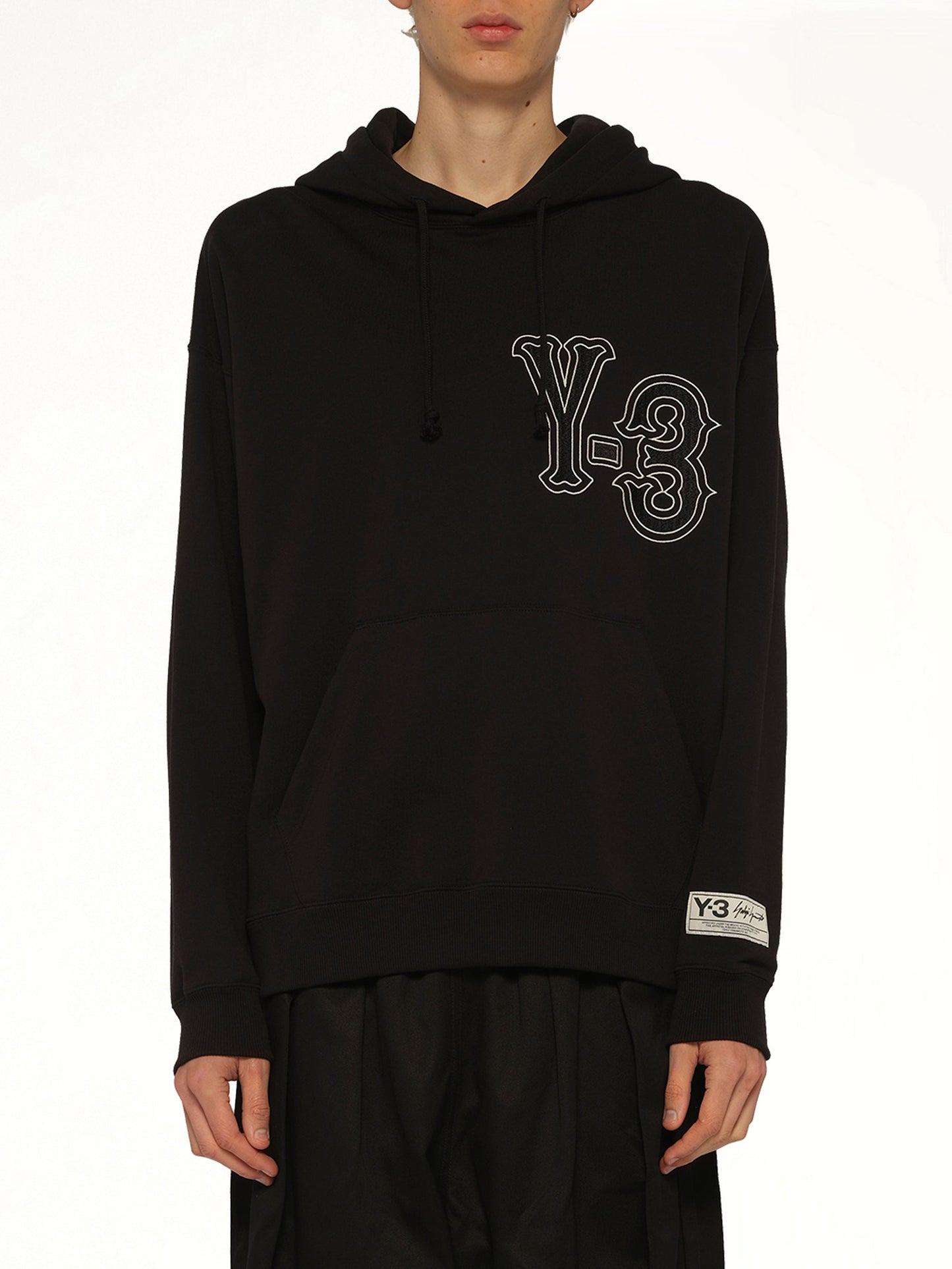 Image of a model wearing Outerwear. Product name - Elite 5 Graphics Hoodie in Black colour by brand - Y-3