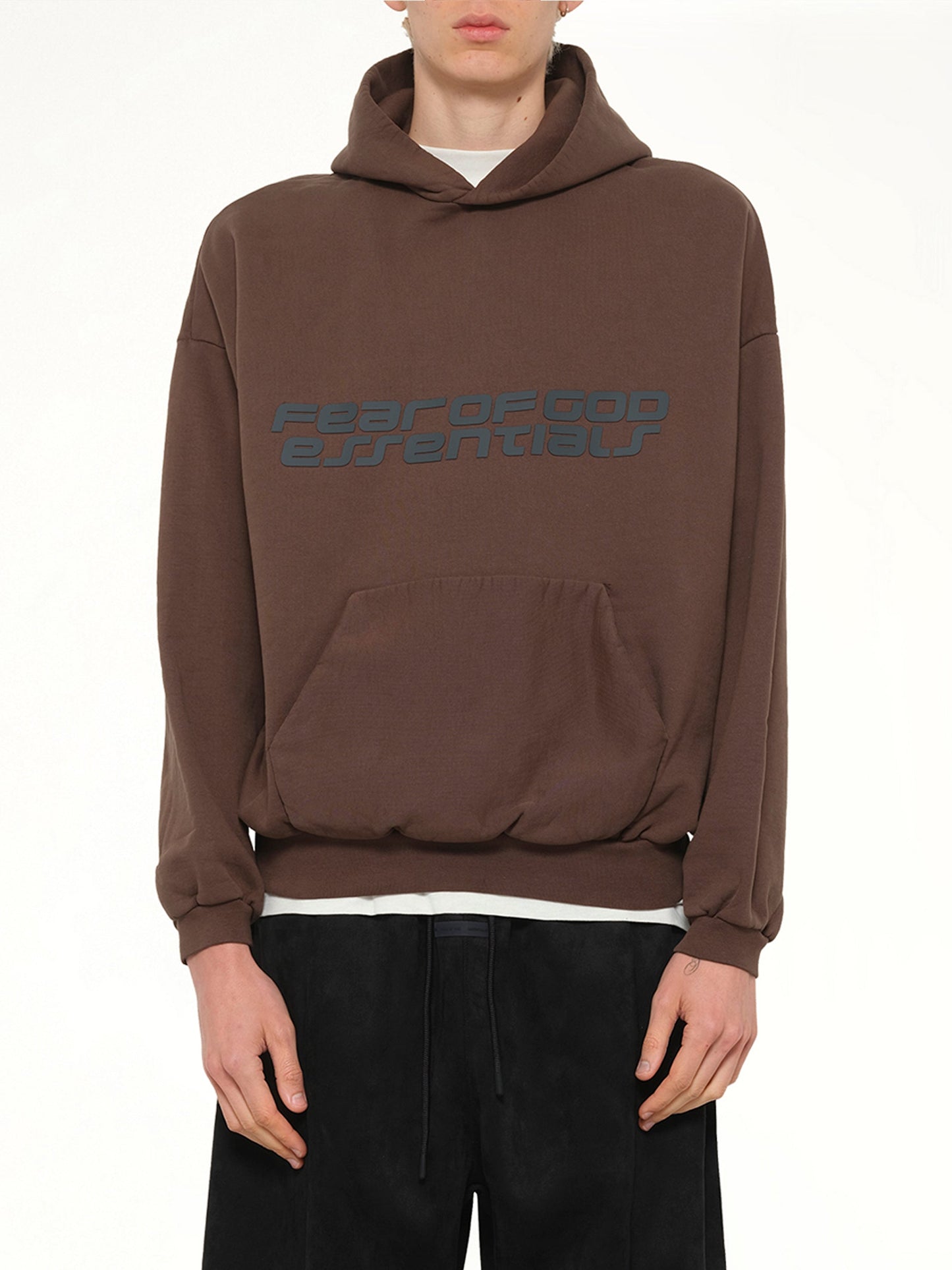 Image of a model wearing Outerwear. Product name - 90's Hoodie in Brown colour by brand - FEAR OF GOD ESSENTIALS