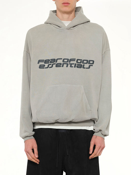 Image of a model wearing Outerwear. Product name - 90's Hoodie in Smoke Grey colour by brand - FEAR OF GOD ESSENTIALS