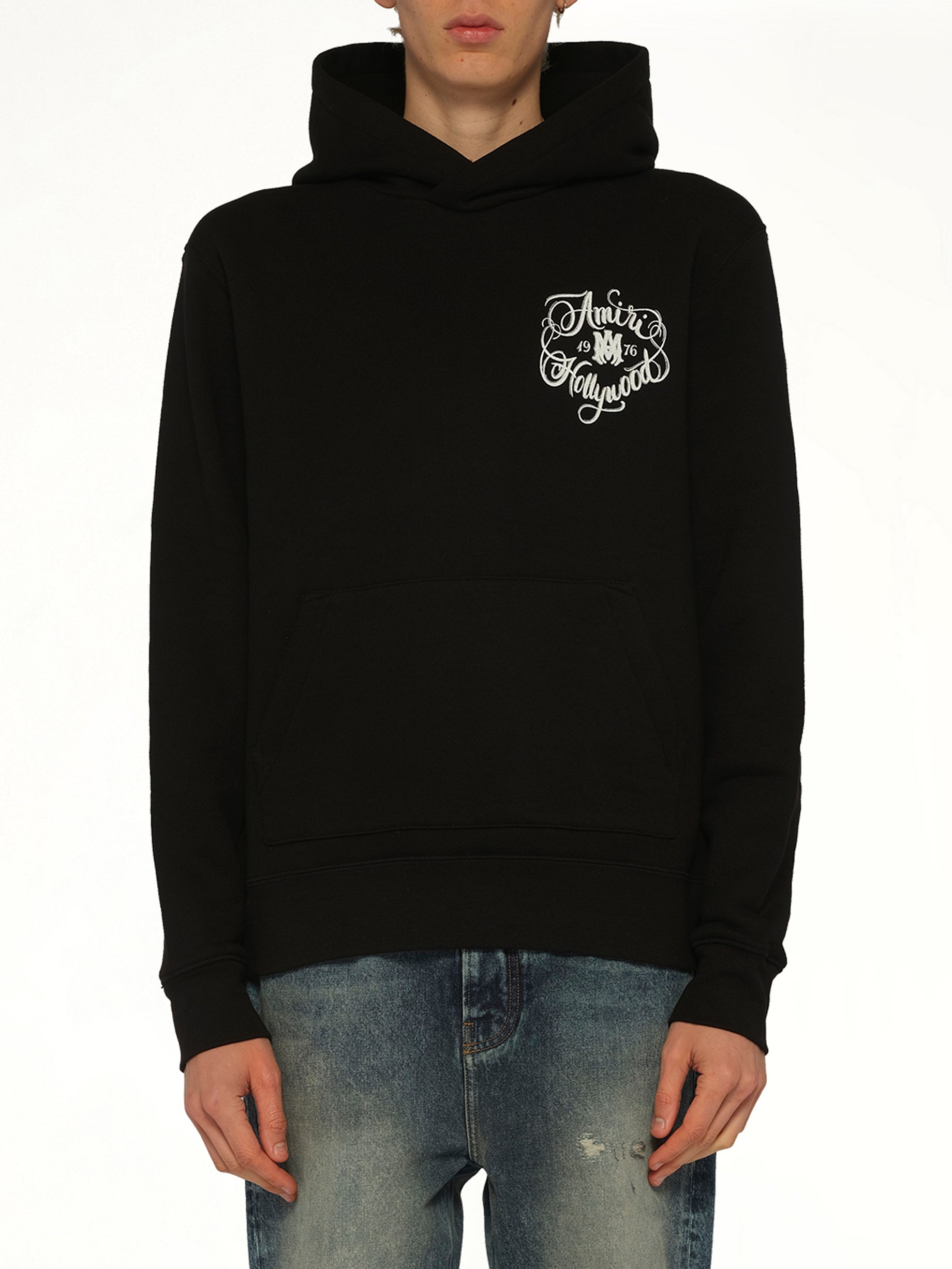 Image of a model wearing Outerwear. Product name - Amiri Hollywood Hoodie in Black colour by brand - AMIRI