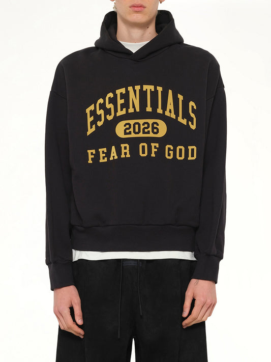 Image of a model wearing Outerwear. Product name - Classic Hoodie in Black colour by brand - FEAR OF GOD ESSENTIALS
