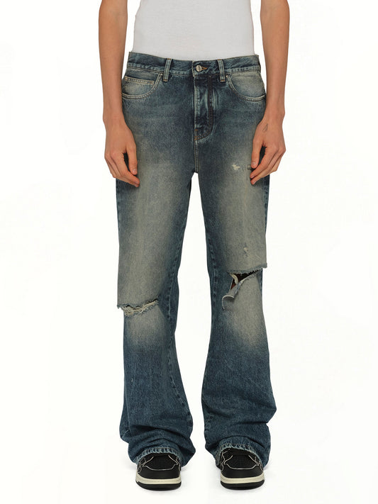 Image of Jeans. Product name - Slashed Boot Cut Jean in Blue colour by brand - AMIRI