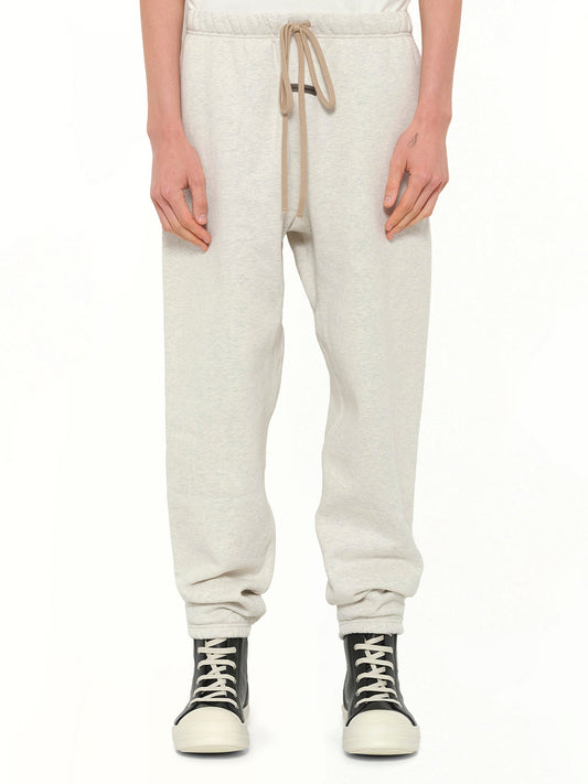 Image of a model wearing Pants. Product name - Classic Sweatpant in Beige colour by brand - FEAR OF GOD ESSENTIALS