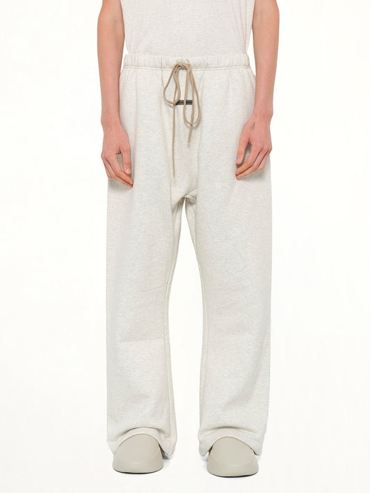 Image of a model wearing Pants. Product name - Flare Sweatpant in Beige colour by brand - FEAR OF GOD ESSENTIALS
