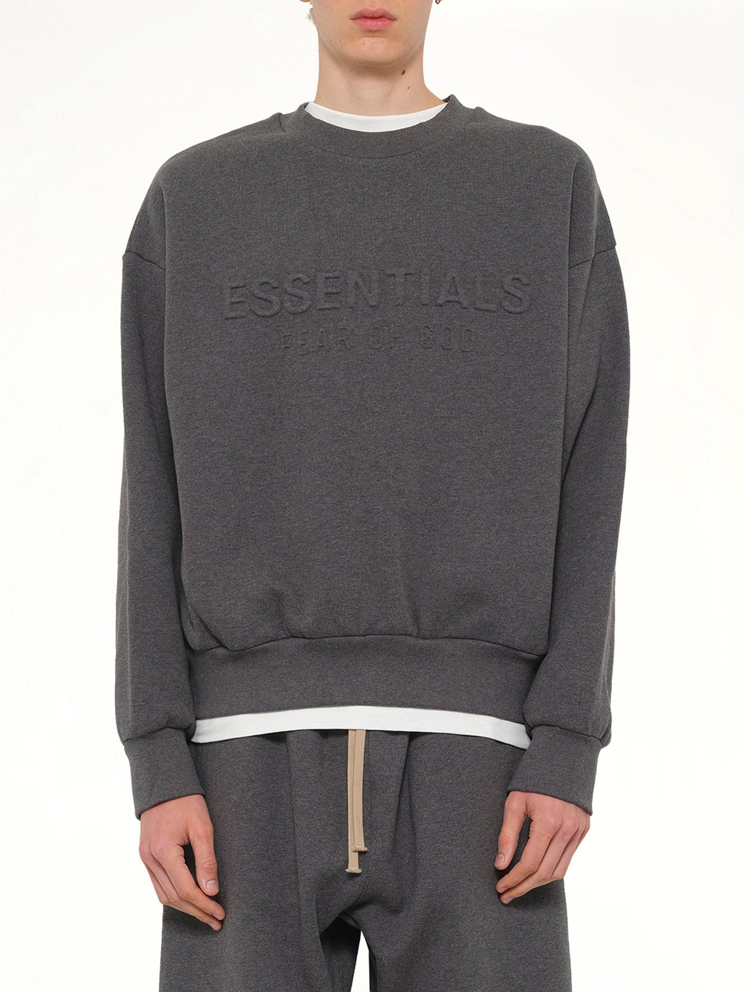 Image of a model wearing Outerwear. Product name - Classic Crewneck Sweatshirt in Charcoal Heather colour by brand - FEAR OF GOD ESSENTIALS
