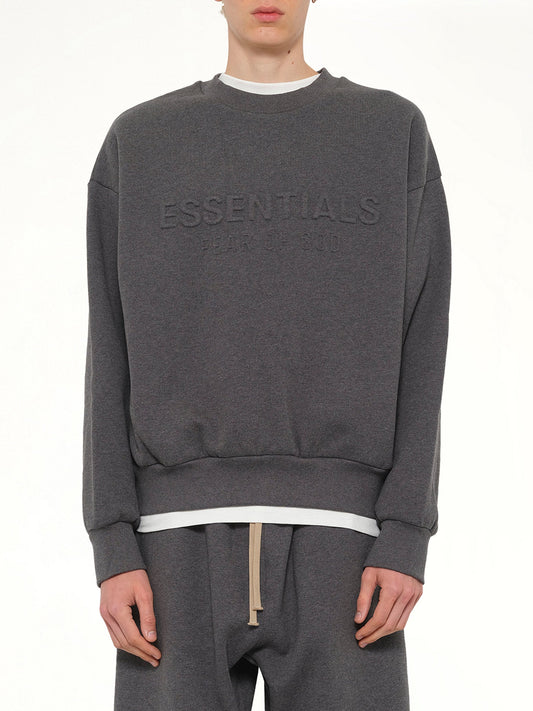 Image of a model wearing Outerwear. Product name - Classic Crewneck Sweatshirt in Charcoal Heather colour by brand - FEAR OF GOD ESSENTIALS