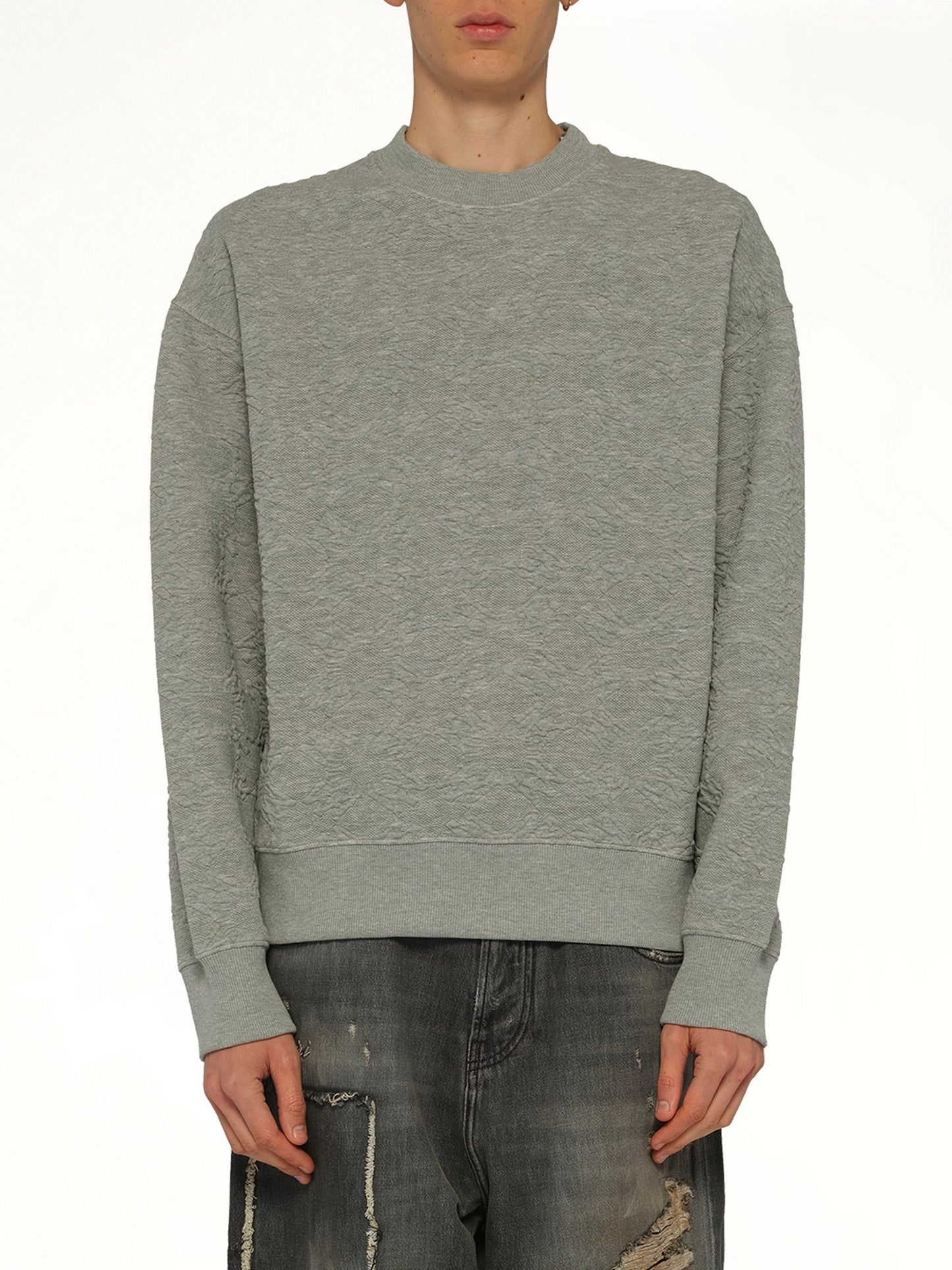 Image of a model wearing Outerwear. Product name - MA Quad Oversized Sweatshirt in Grey colour by brand - AMIRI