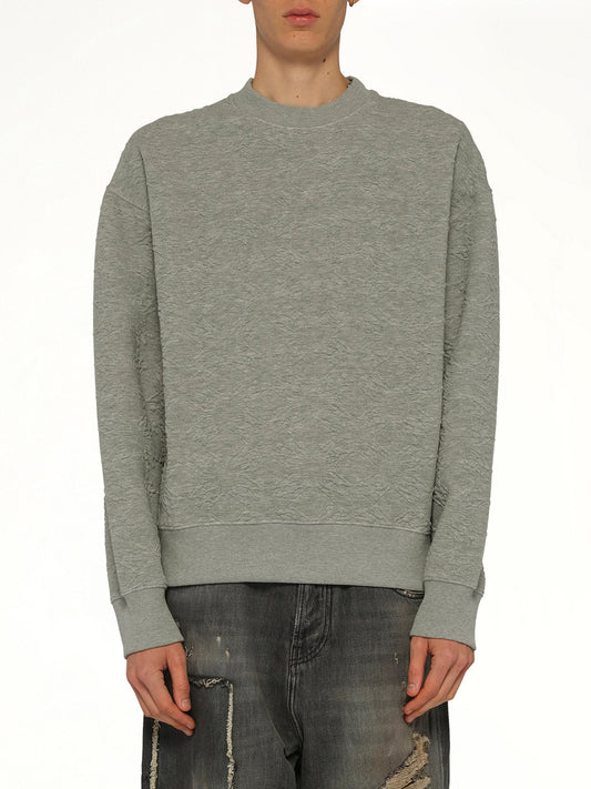 Image of a model wearing Outerwear. Product name - MA Quad Oversized Sweatshirt in Grey colour by brand - AMIRI