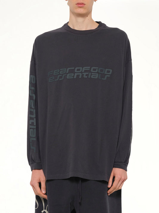 Image of a model wearing Tops. Product name - 90's Long Sleeve T-Shirt in Black colour by brand - FEAR OF GOD ESSENTIALS