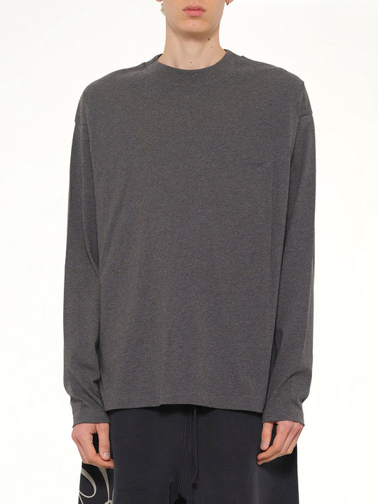 Image of a model wearing Tops. Product name - Classic Long Sleeve T-Shirt in Charcoal Heather colour by brand - FEAR OF GOD ESSENTIALS
