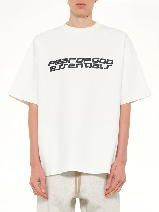 Image of a model wearing Tops. Product name - 90's Short Sleeve T-Shirt in Ivory colour by brand - FEAR OF GOD ESSENTIALS