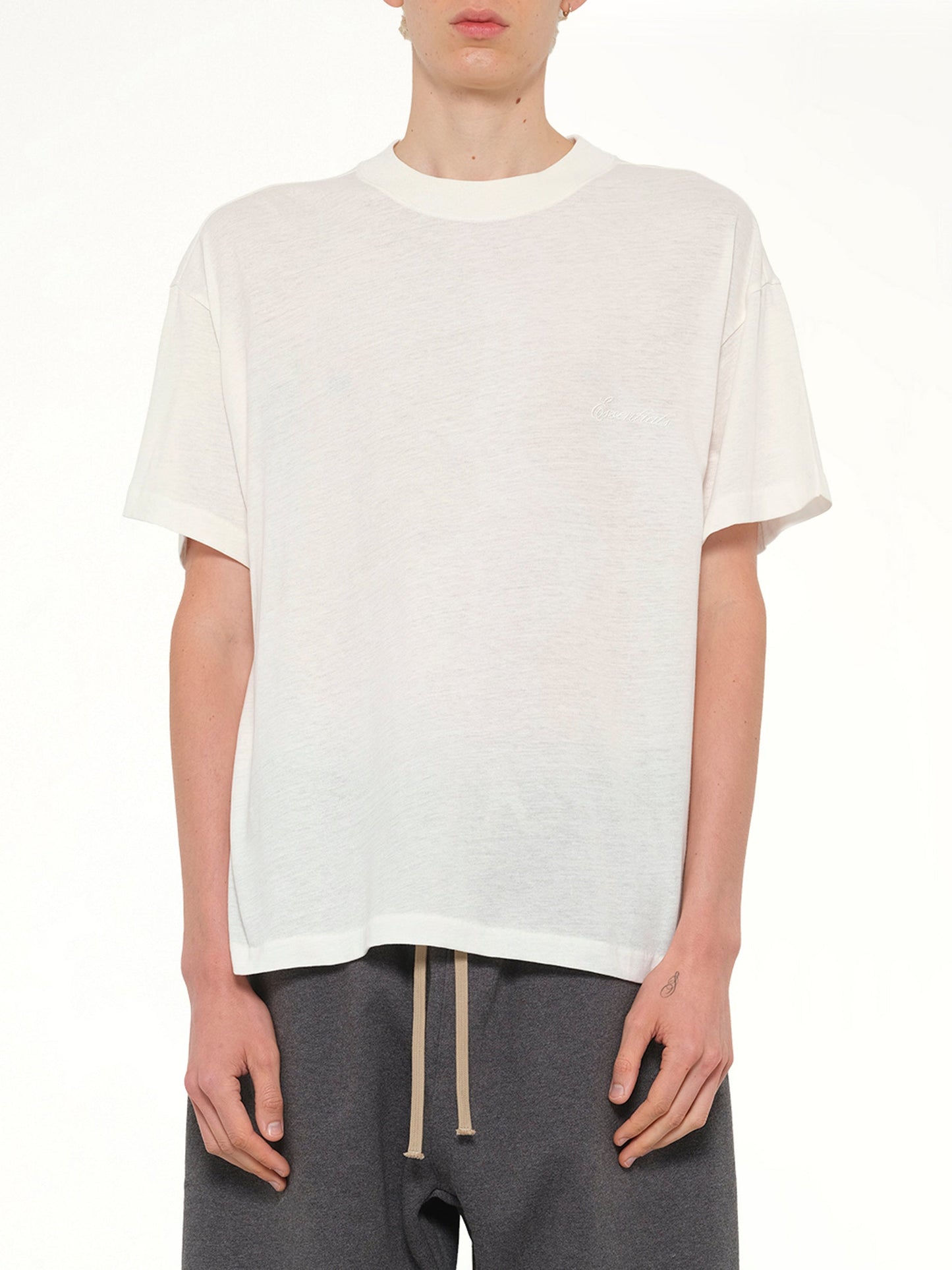 Image of T-Shirts. Product name - Essential T-Shirt in Ivory colour by brand - FEAR OF GOD ESSENTIALS