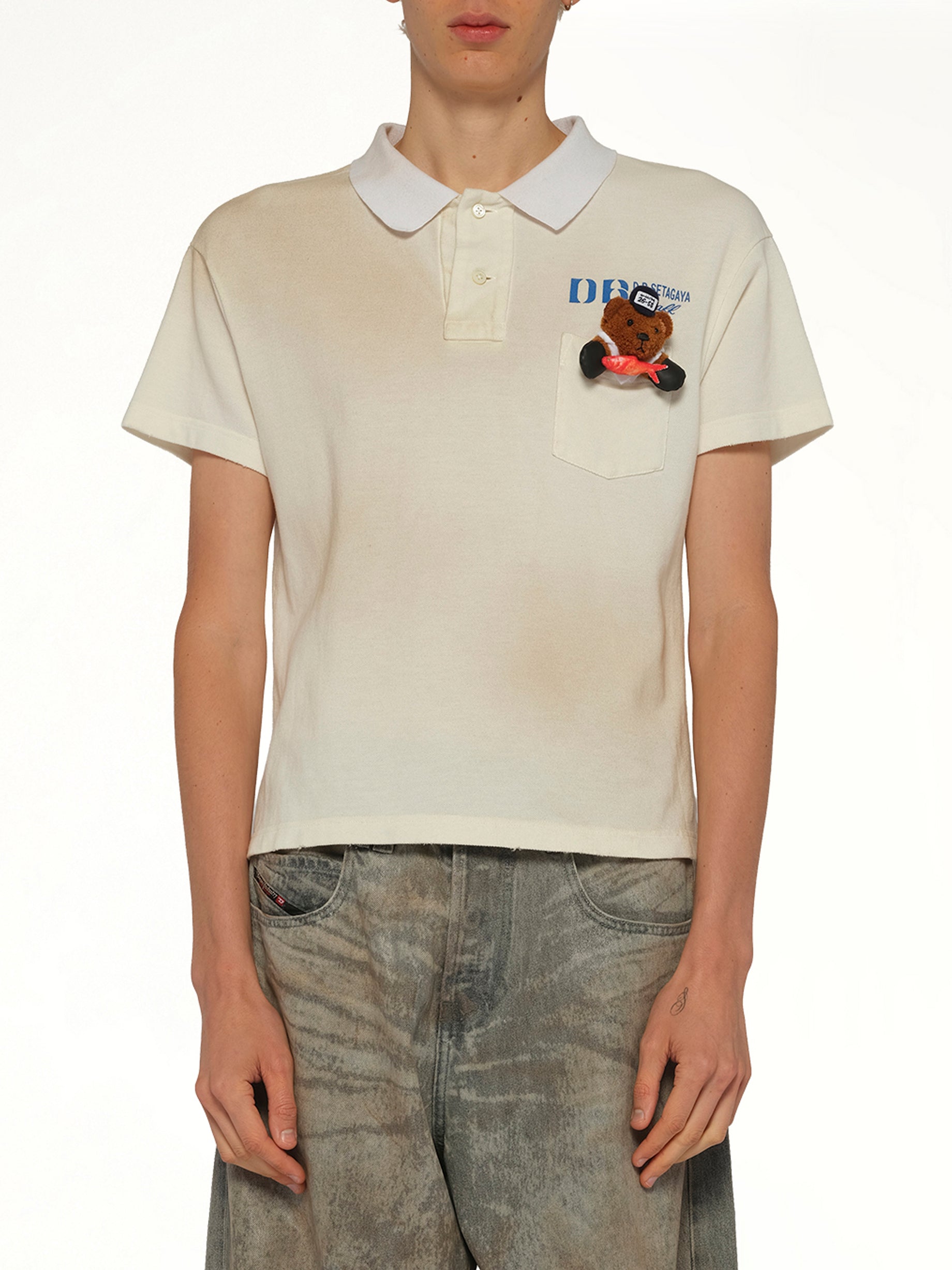 Image of a model wearing Uniforms & Workwear. Product name - Polo Shirt With My Workwear Bear in White colour by brand - DOUBLET