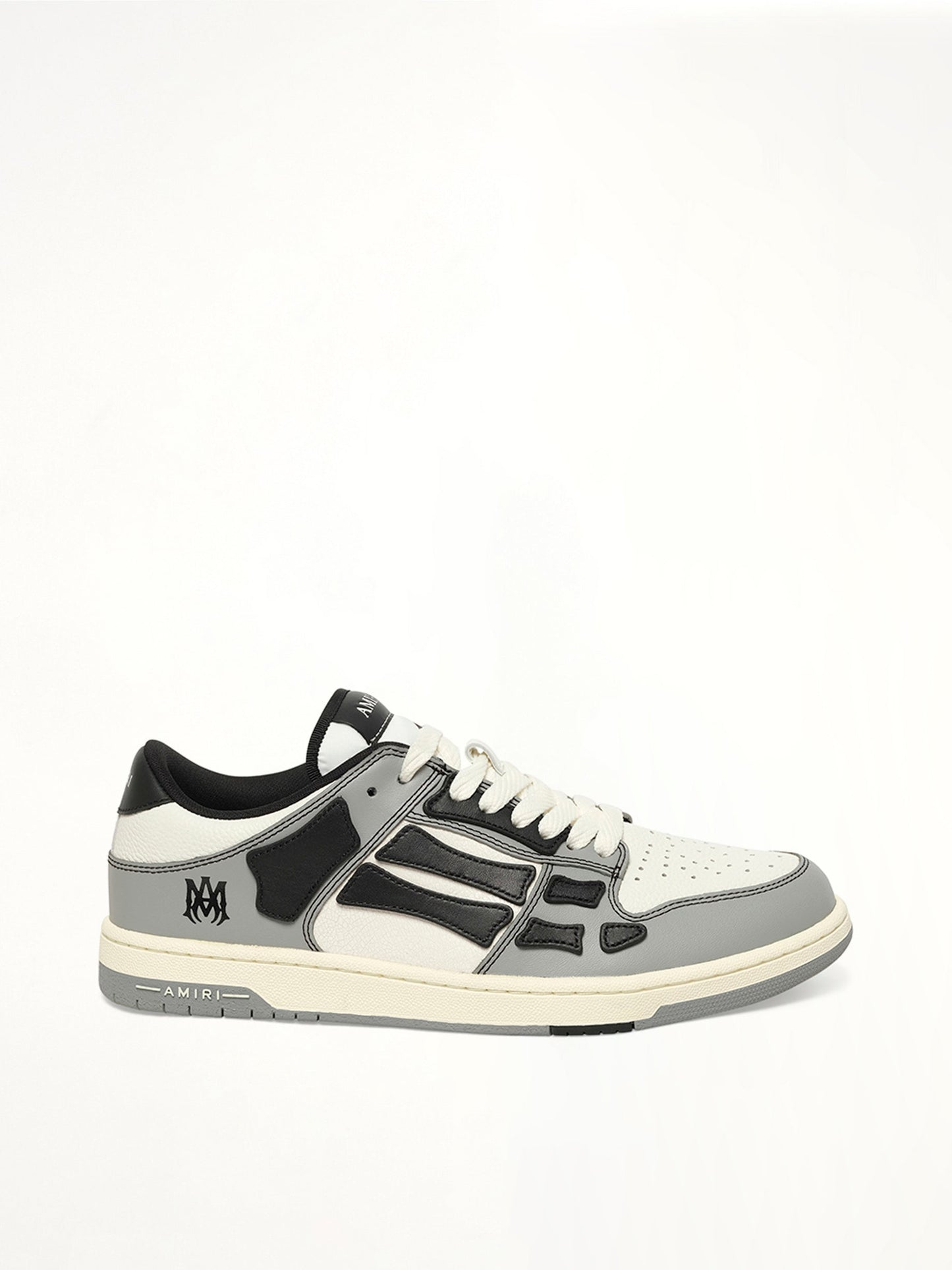 Image of Sneakers. Product name - Varsity Skel Top Low in Black colour by brand - AMIRI