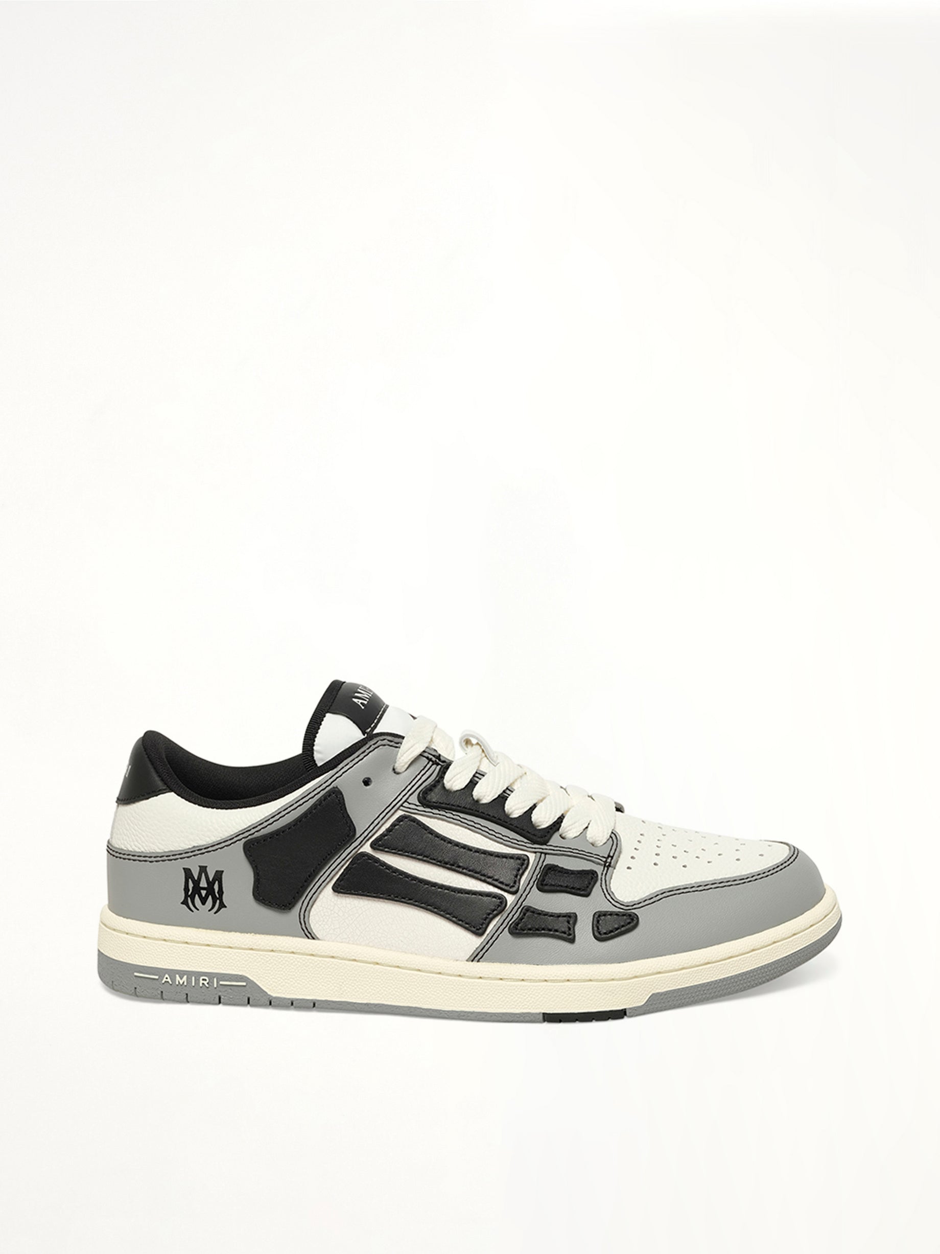 Image of Sneakers. Product name - Varsity Skel Top Low in Black colour by brand - AMIRI