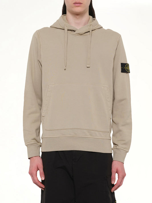 Image of a model wearing Outerwear. Product name - 610006 Cotton Fleece Hoodie in Desert colour by brand - STONE ISLAND