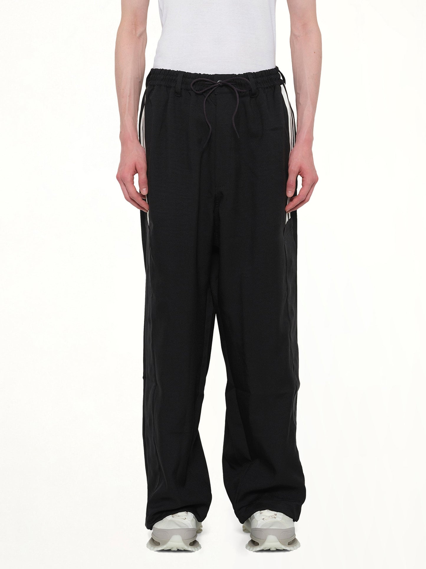 Image of a model wearing Pants. Product name - Basketball Pants in Black colour by brand - Y-3