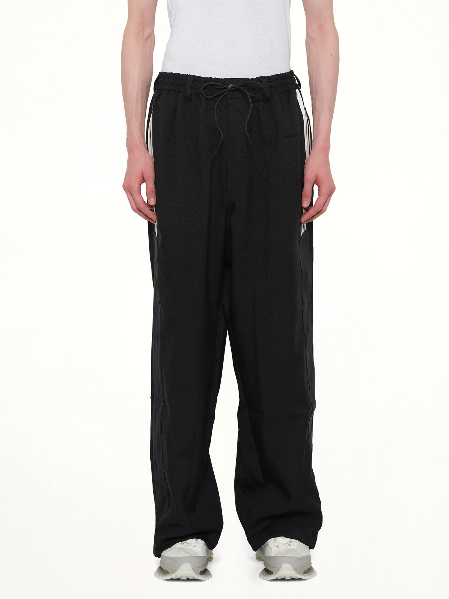 Image of a model wearing Pants. Product name - Basketball Pants in Black colour by brand - Y-3