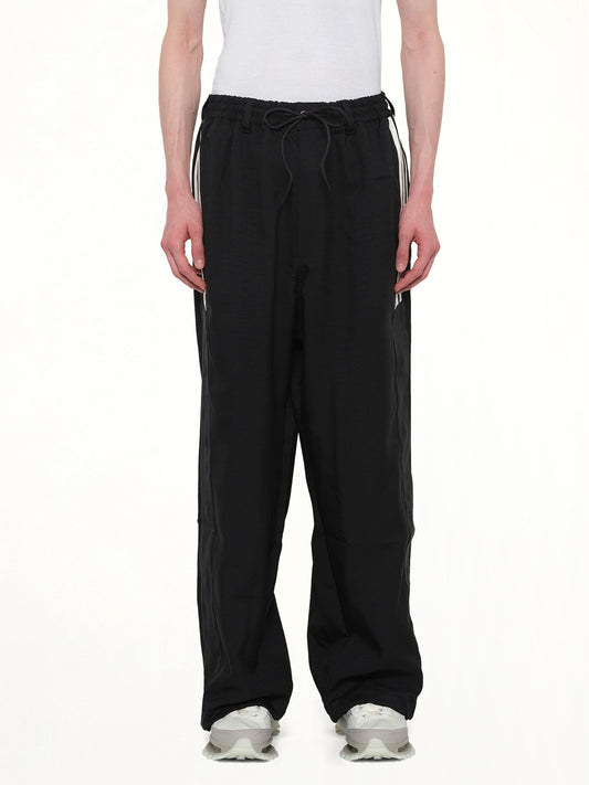 Image of a model wearing Pants. Product name - Basketball Pants in Black colour by brand - Y-3