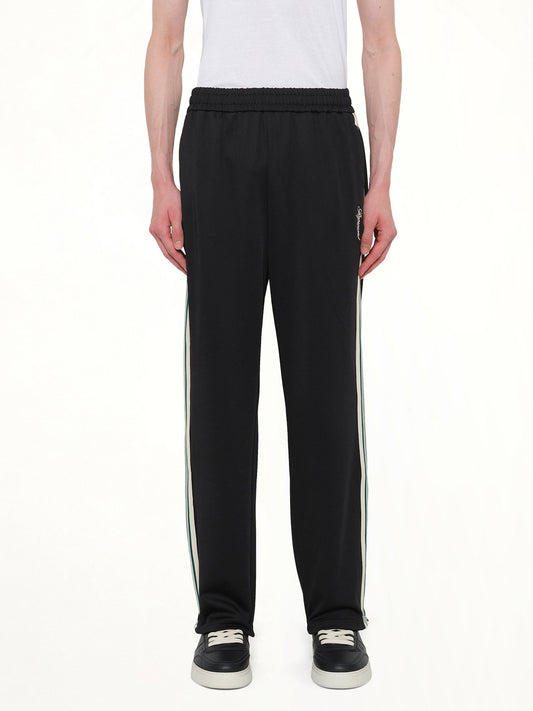 Image of a model wearing Pants. Product name - Taped Track Pant in Black colour by brand - REPRESENT