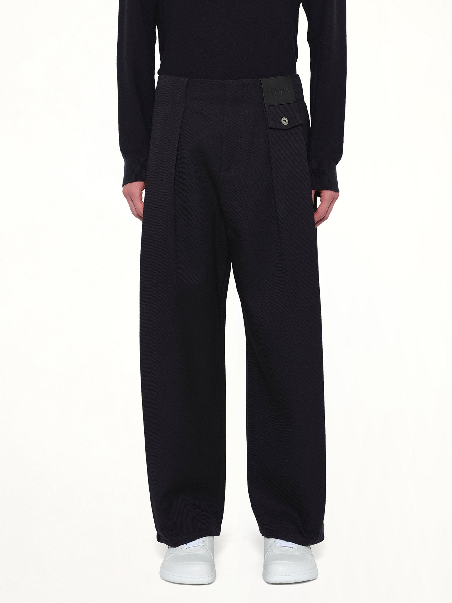 Image of a model wearing Pants. Product name - Belted Trouser AF in Navy colour by brand - LOEWE