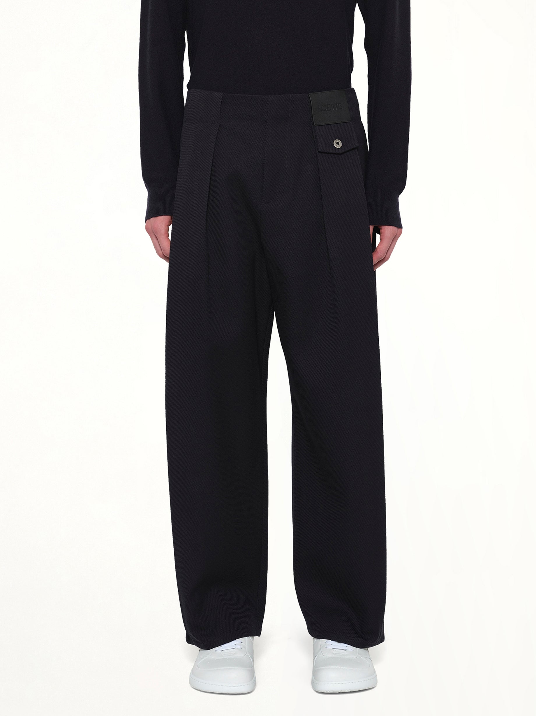 Image of a model wearing Pants. Product name - Belted Trouser AF in Navy colour by brand - LOEWE