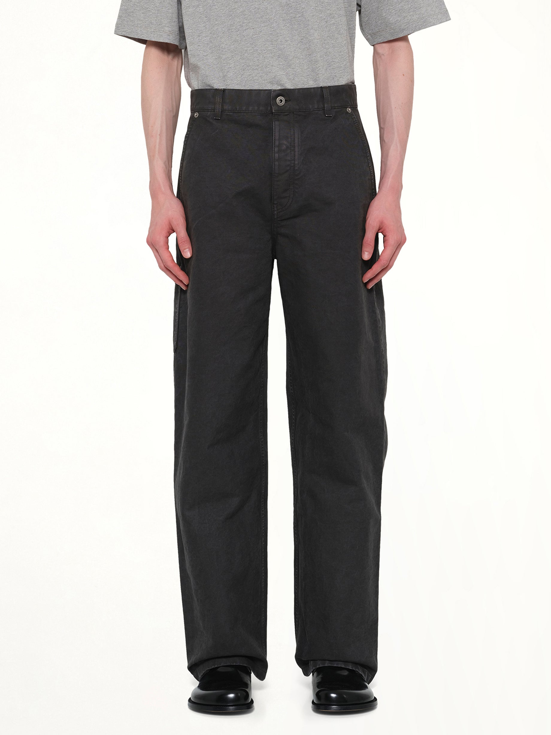 Image of a model wearing Pants. Product name - Cotton Trouser in Anthracite colour by brand - LOEWE