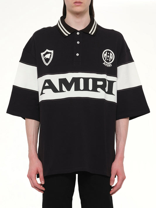 Image of a model wearing Tops. Product name - Amiri Sport Oversized Polo in Black colour by brand - AMIRI