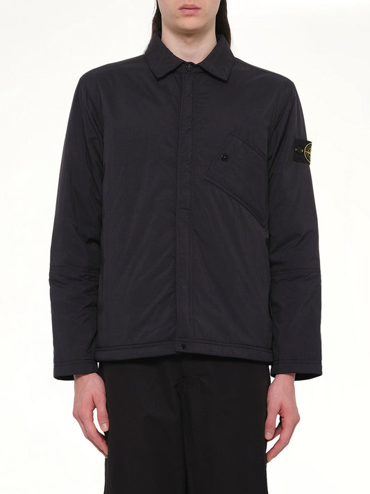 Image of a model wearing Tops. Product name - 1200007 Overshirt in Black colour by brand - STONE ISLAND
