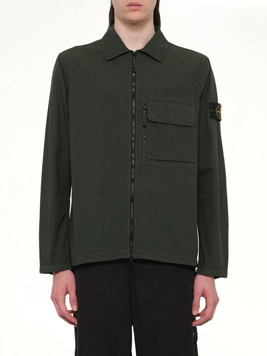 Image of a model wearing Tops. Product name - 120000 Overshirt in Juniper colour by brand - STONE ISLAND