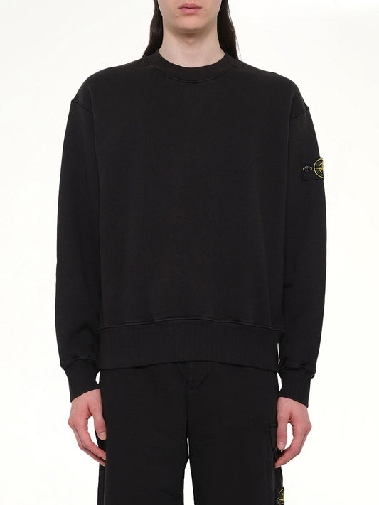 Image of a model wearing Outerwear. Product name - 610002 Heavy Cotton Fleece Sweatshirt in Black colour by brand - STONE ISLAND
