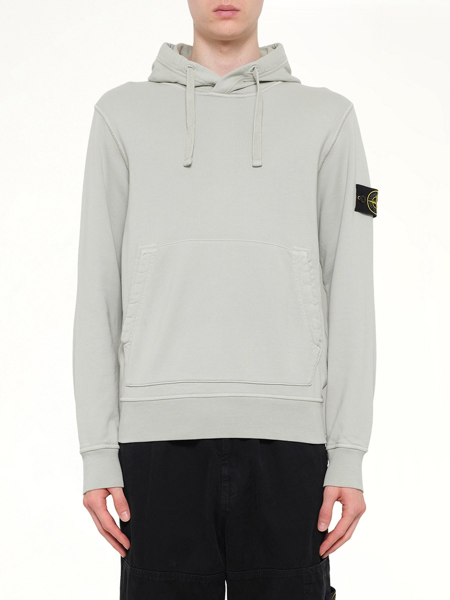 Image of a model wearing Outerwear. Product name - 6100062 Hoodie Sweater in Grey colour by brand - STONE ISLAND