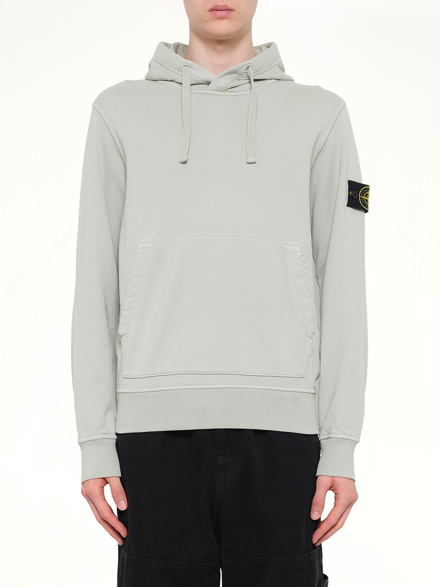 Image of a model wearing Outerwear. Product name - 6100062 Hoodie Sweater in Grey colour by brand - STONE ISLAND