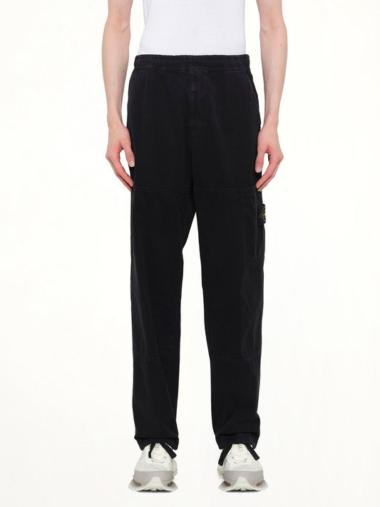 Image of a model wearing Pants. Product name - 3100005 Trousers in Black colour by brand - STONE ISLAND