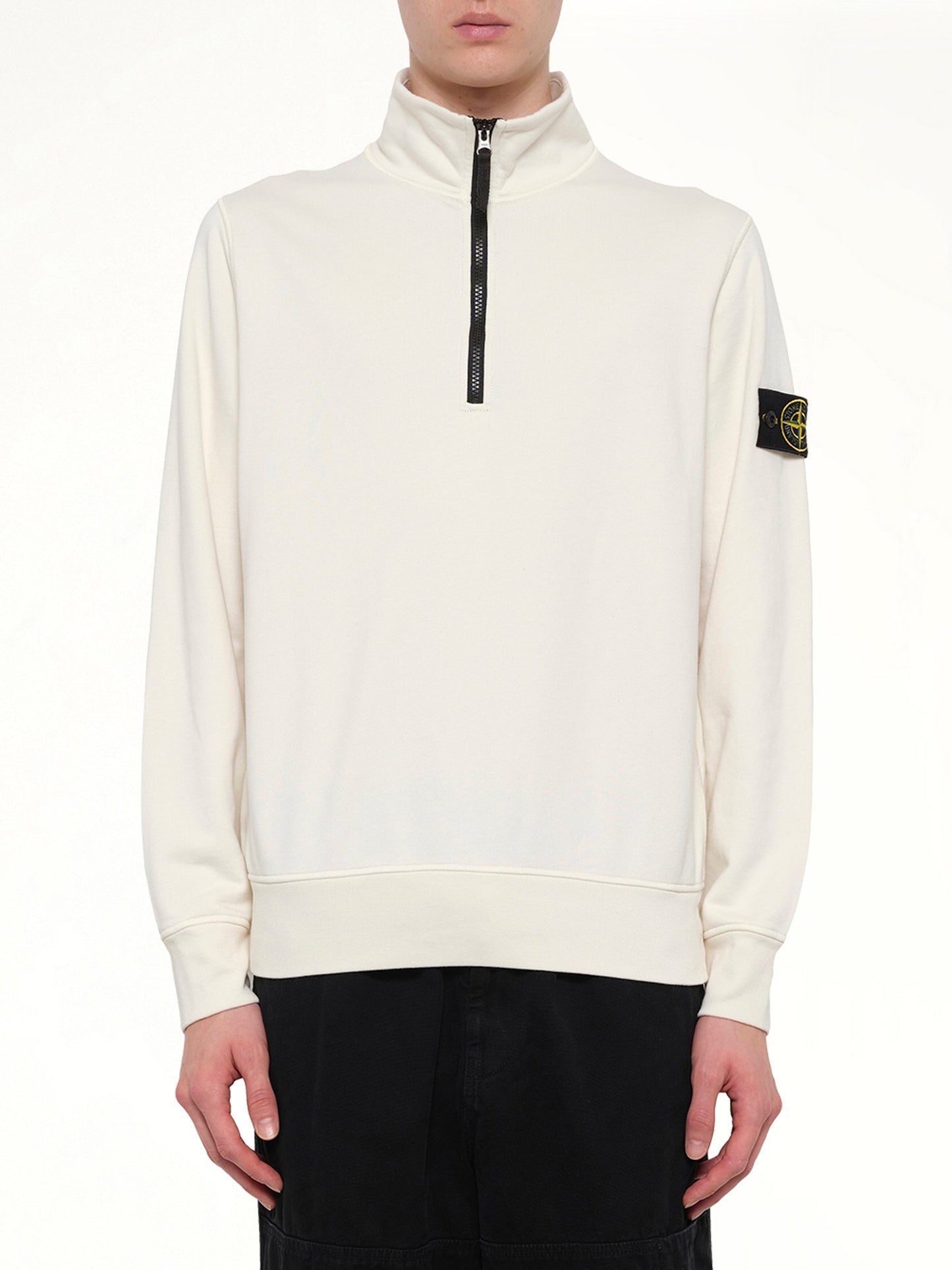 Image of a model wearing Outerwear. Product name - 6100070 LS Polo in Ivory colour by brand - STONE ISLAND