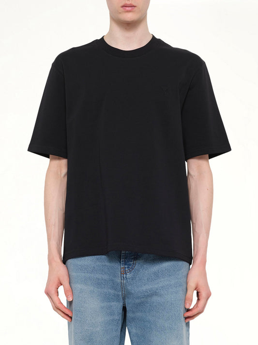 Image of T-Shirts. Product name - Small Embossed ADC T-Shirt in Black colour by brand - AMI PARIS