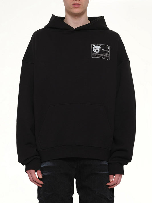 Image of a model wearing Outerwear. Product name - DNA Teddy ID Hoodie in Black colour by brand - WE11DONE