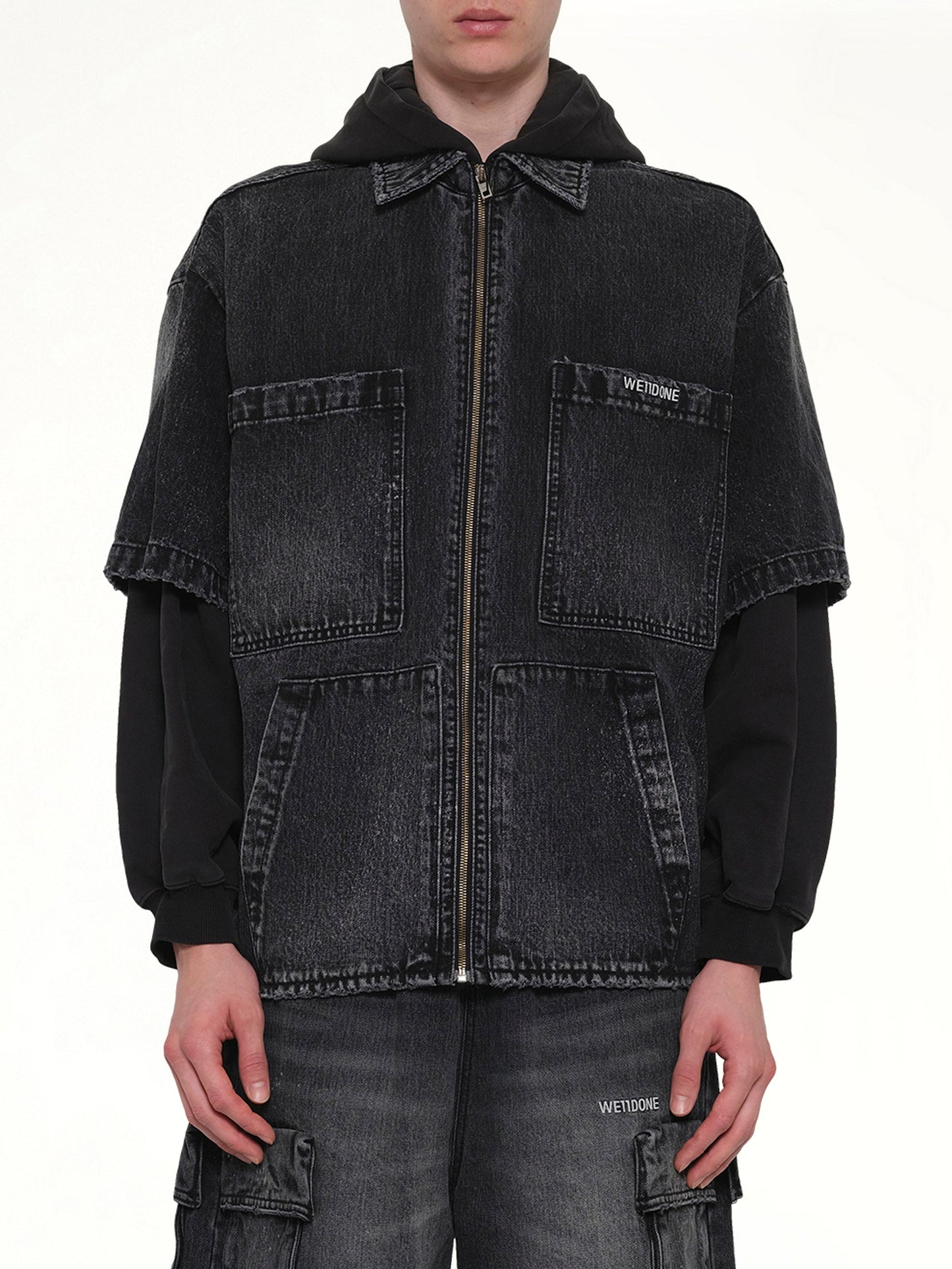 Image of a model wearing Outerwear. Product name - Faded Layered Hoodie Jacket in Black colour by brand - WE11DONE