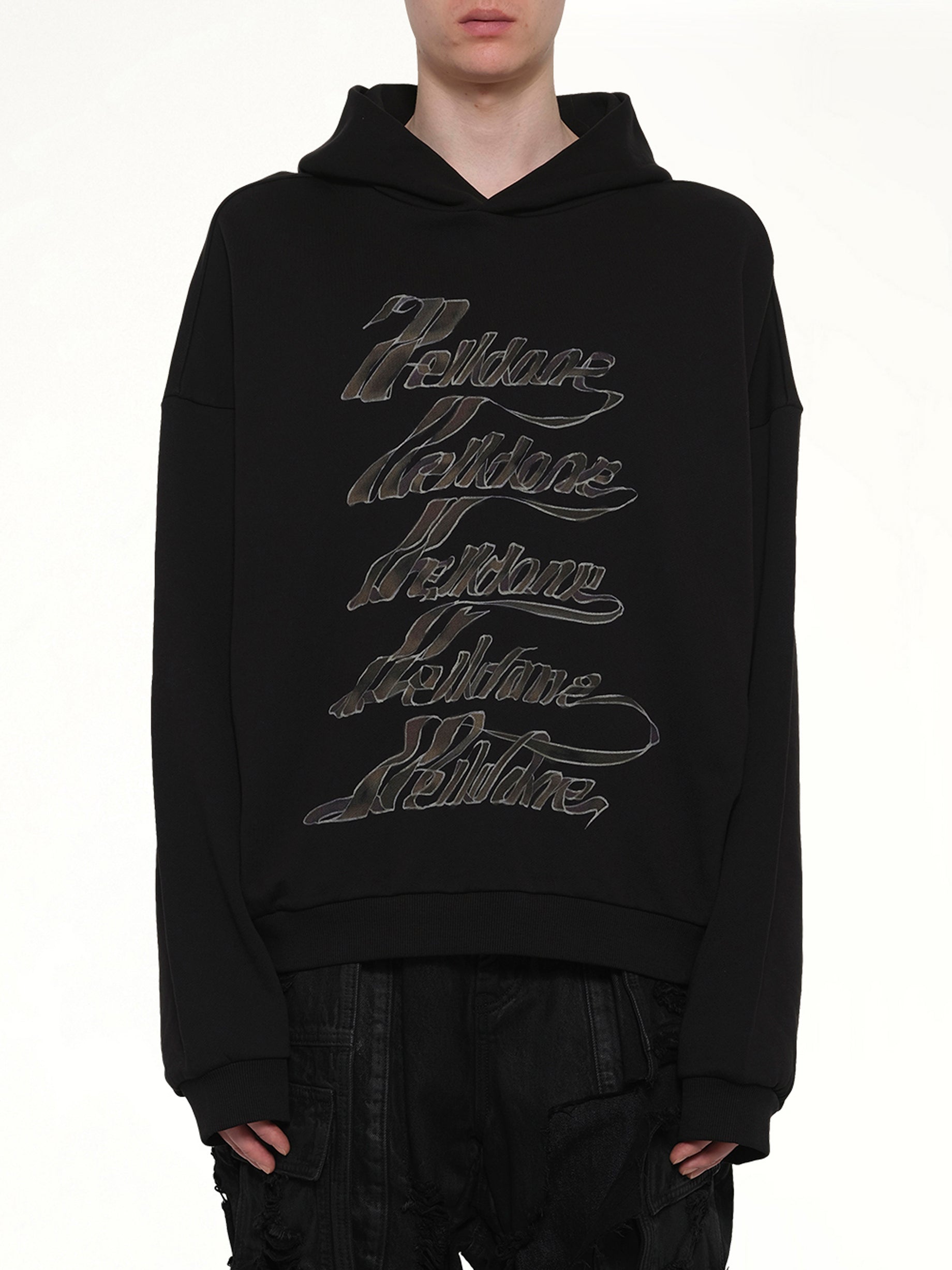 Image of a model wearing Outerwear. Product name - Ribbon Multi-Logo Hoodie in Black colour by brand - WE11DONE
