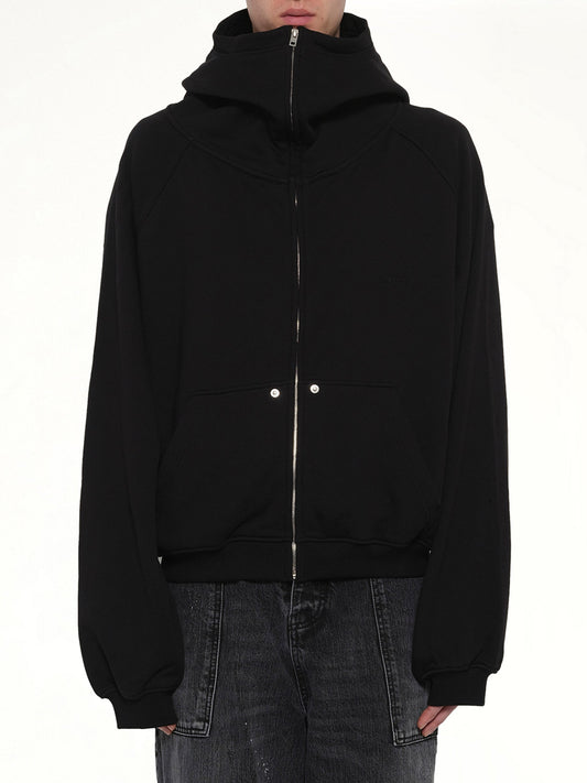 Image of a model wearing Outerwear. Product name - Snap-Detail Jersey Zip-Up Hoodie in Black colour by brand - WE11DONE