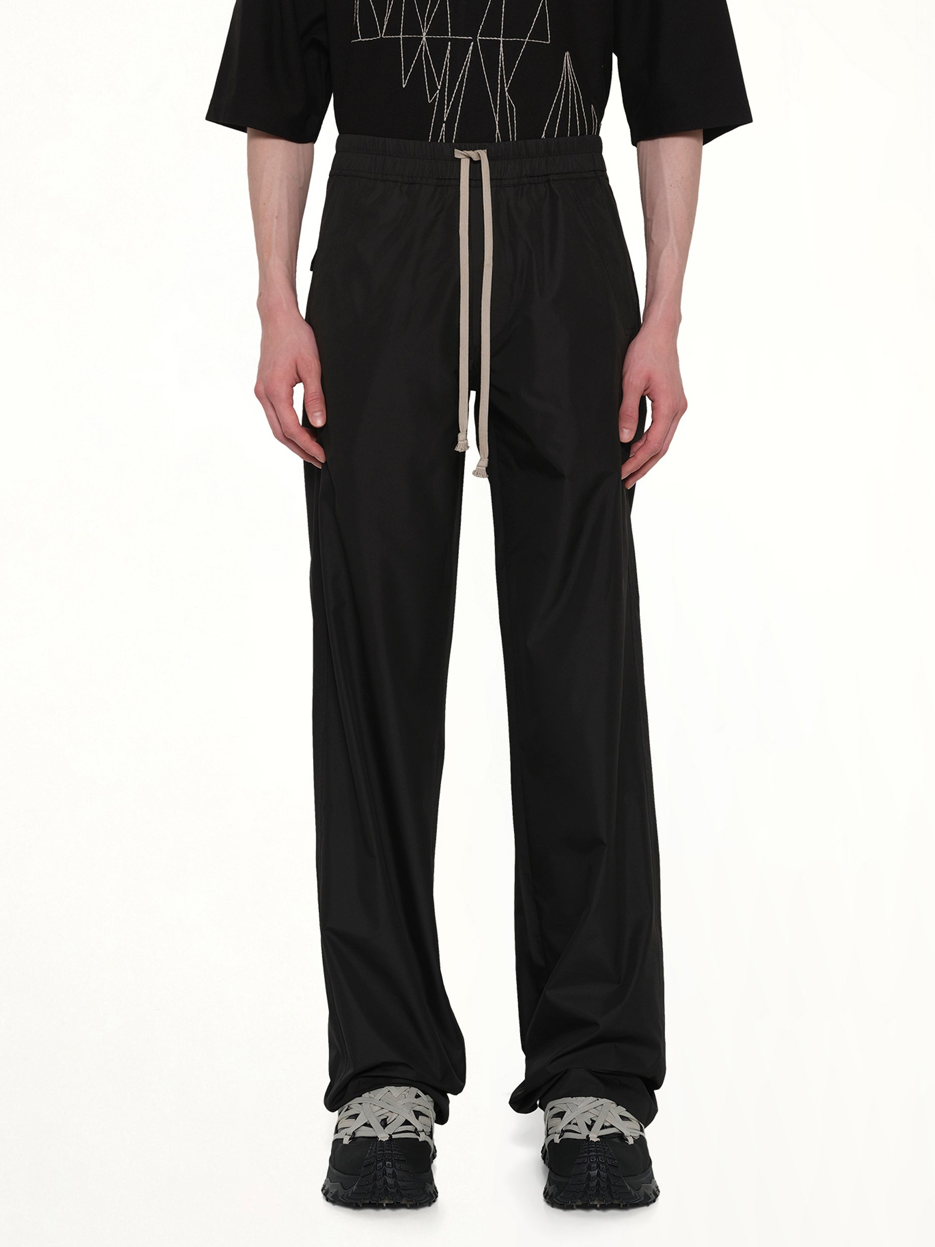 Image of a model wearing Pants. Product name - Rick Owens x Moncler Drawstring Pants in Black colour by brand - RICK OWENS