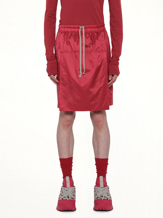 Image of a model wearing Shorts. Product name - Rick Owens x Moncler Kiltshorts in Carnelian colour by brand - RICK OWENS