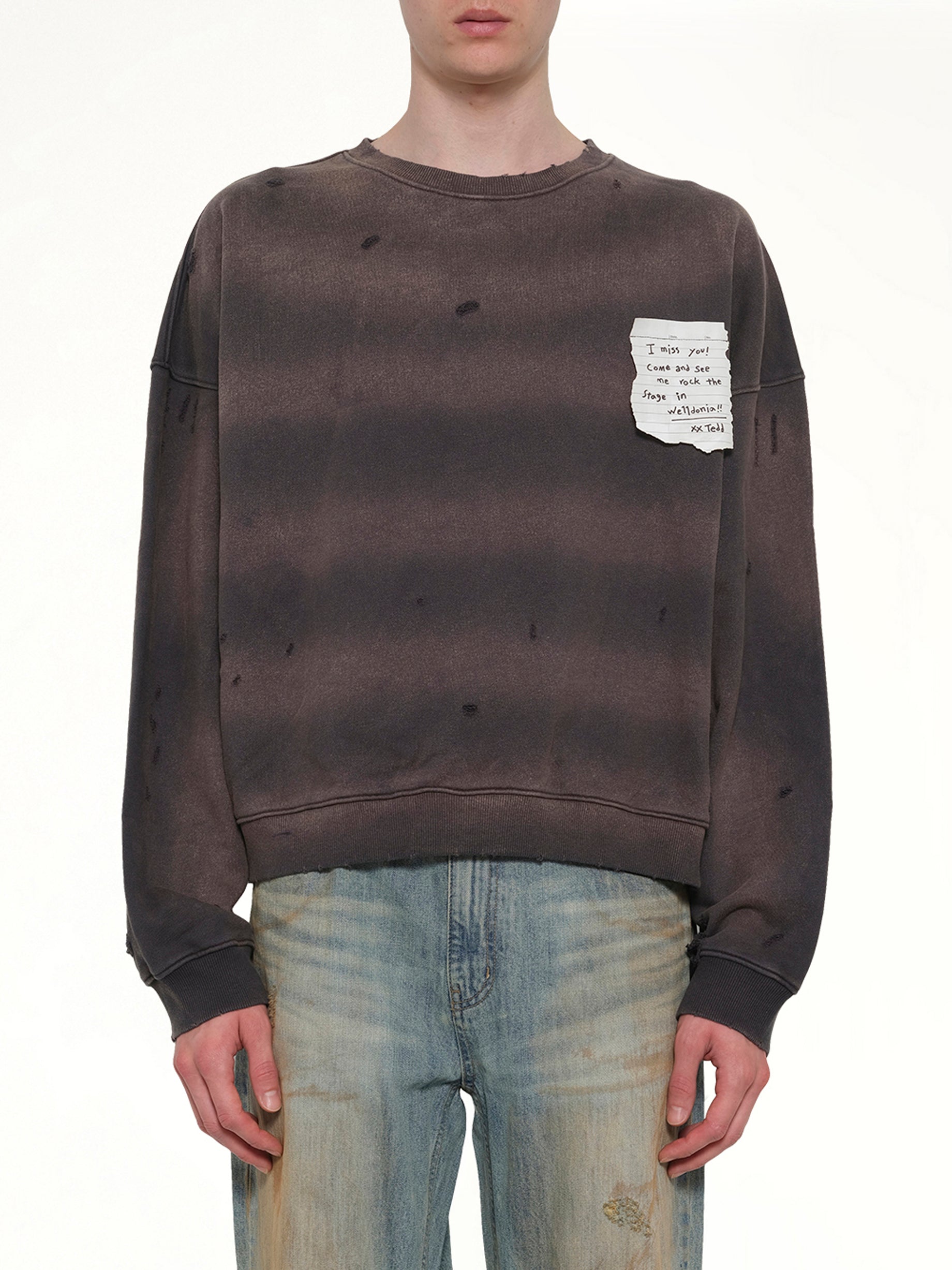 Image of a model wearing Outerwear. Product name - Paper Note Grunge Sweatshirt in Grey colour by brand - WE11DONE