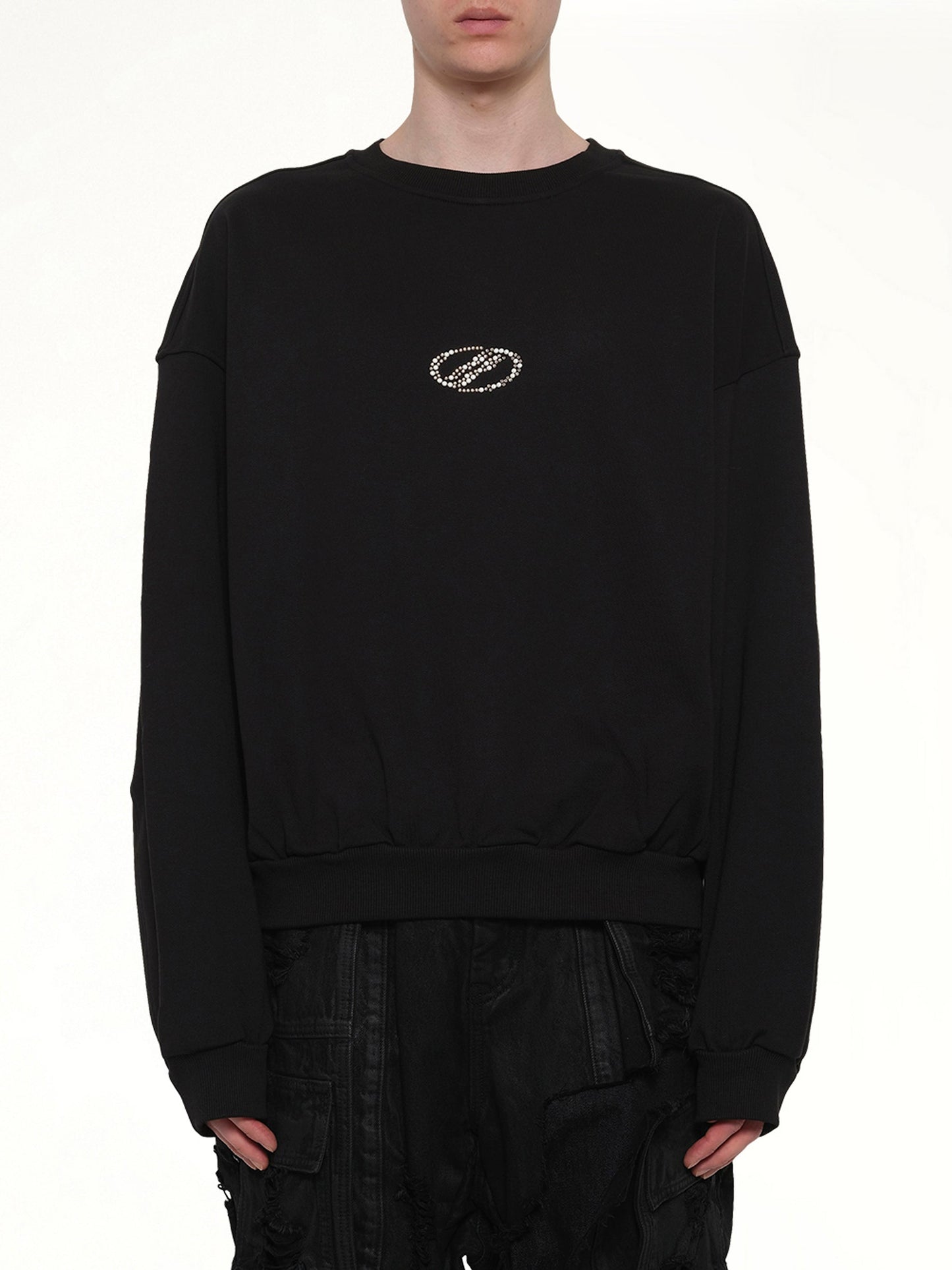 Image of a model wearing Outerwear. Product name - Rhinestone Balloon-Fit Sweatshirt in Black colour by brand - WE11DONE