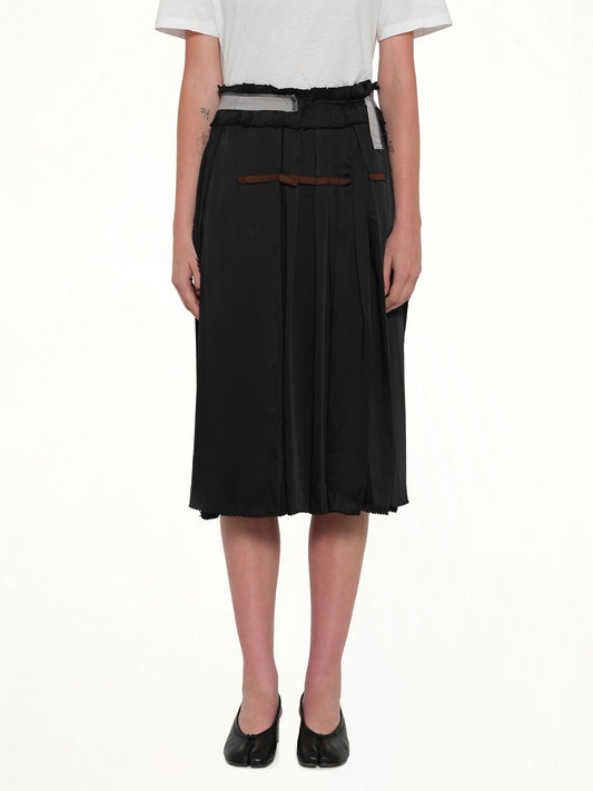 Image of a model wearing Skirts. Product name - Layered Skirt in Black colour by brand - MAISON MARGIELA